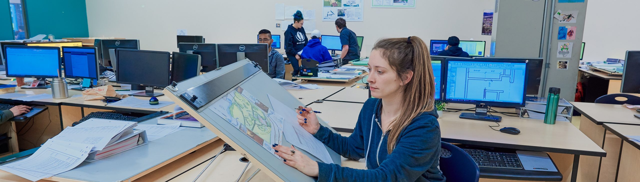 A female student doing drafting