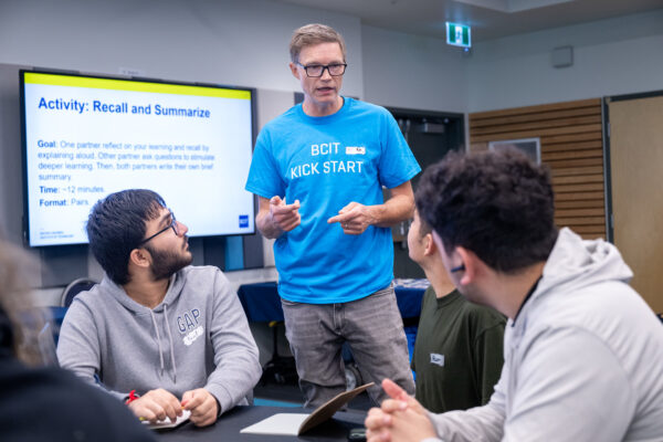 Learning Strategist talking to students
